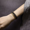 Unisex lava stone mala bracelet styled on a wrist