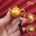 Personalized Ox Chinese Zodiac keychain, a sturdy spinning teapot luck charm for determination and success in your birth year.