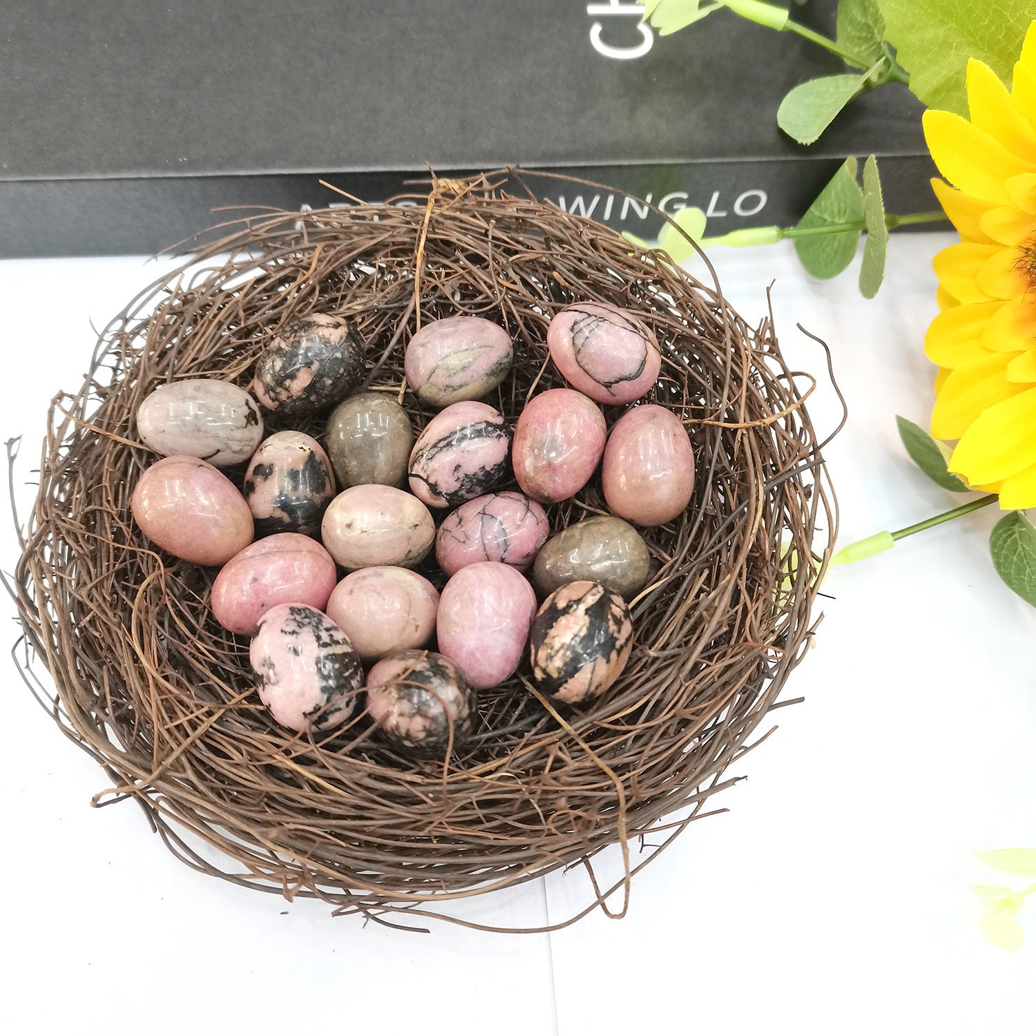 Rhodonite crystal egg for emotional balance, compassion, and healing emotional wounds