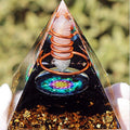 Clear quartz and obsidian crystal pyramid for purification and powerful grounding.