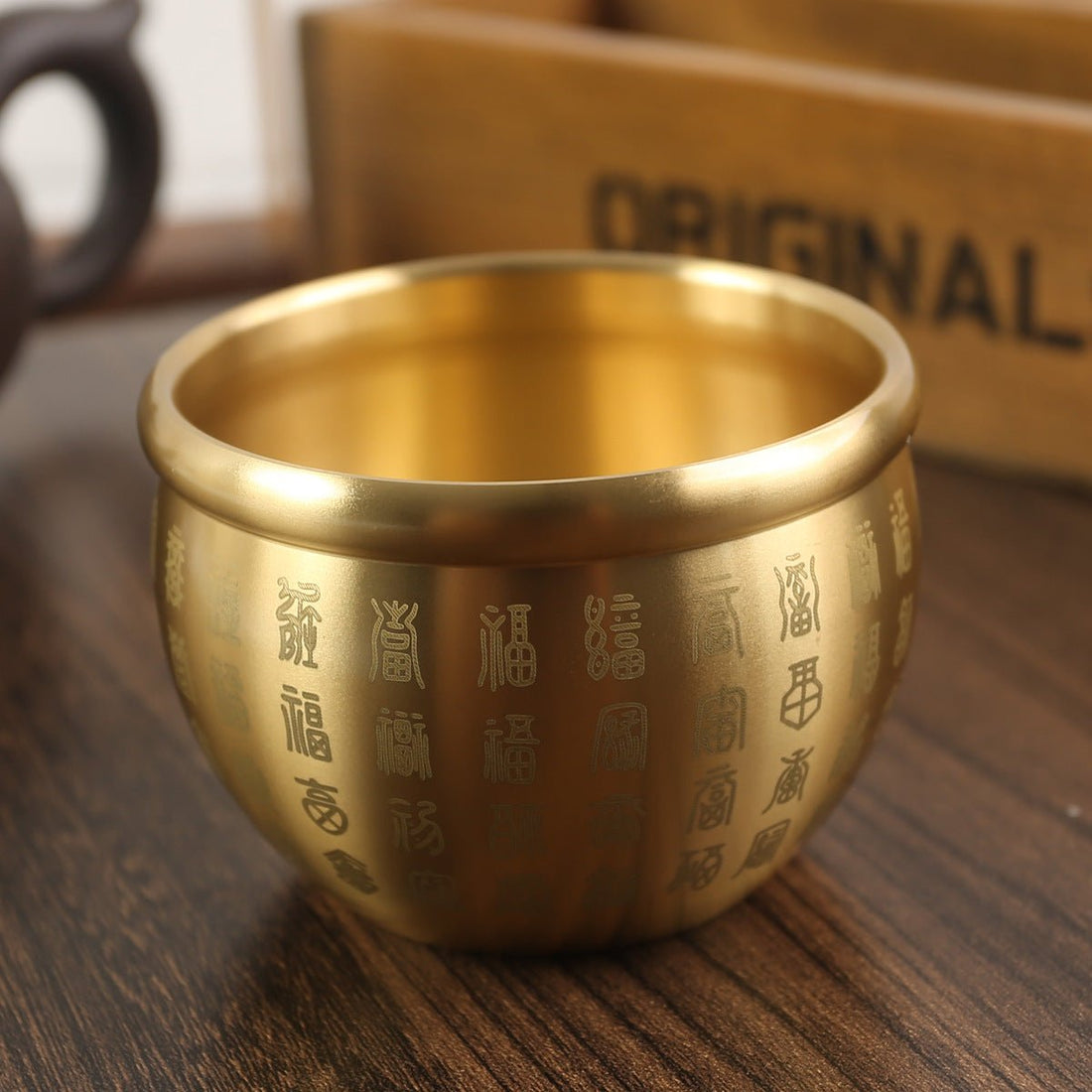 Feng Shui Brass Wealth Jar with coin, a "Hundred Fortunes" money pot for attracting abundance and good luck.