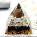 Tiger's eye pyramid with triple spiral for vitality, protection, and energy movement.