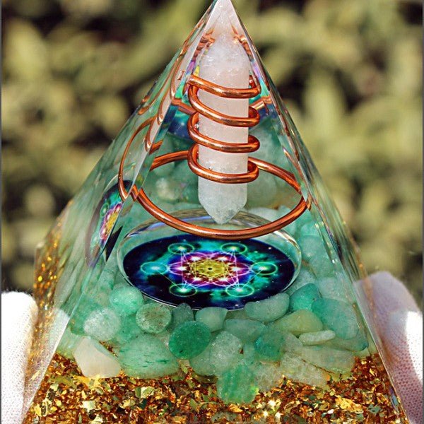 Clear quartz and green aventurine pyramid for amplifying abundance and healing.