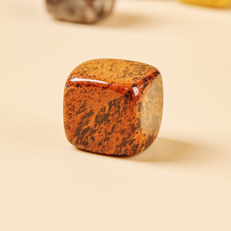 Red Obsidian crystal incense holder for passion and strength, ideal for Reiki healing spaces.