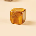 Tiger's Eye incense stick holder for confidence and protection during yoga and mindfulness.