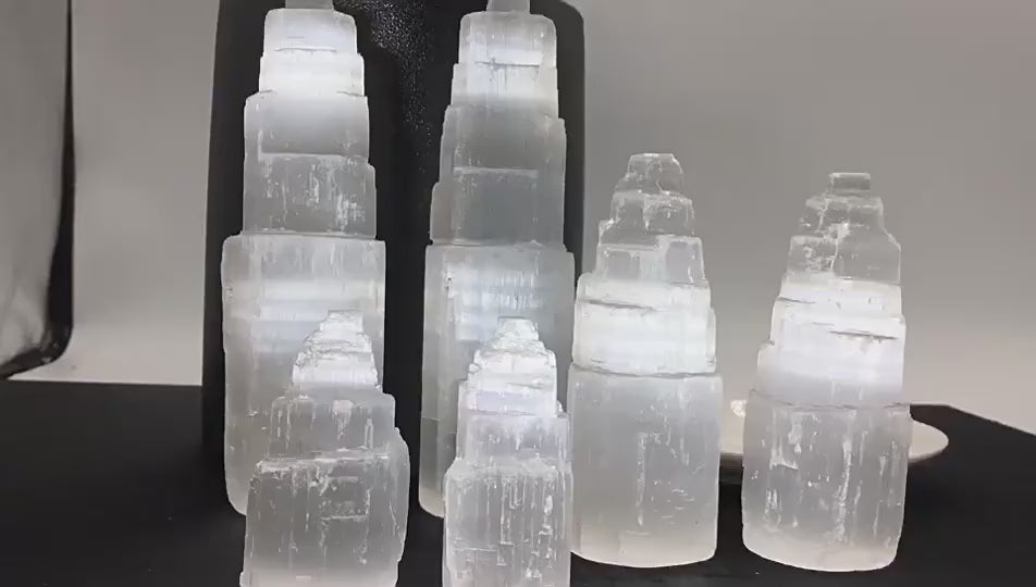 Natural Moroccan Selenite Light Tower, a self-cleansing energy obelisk for home purification and meditation.