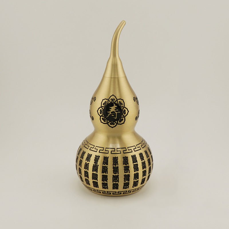 Macro view of the Shou (寿) longevity symbol on the brass gourd, for health and a long life.