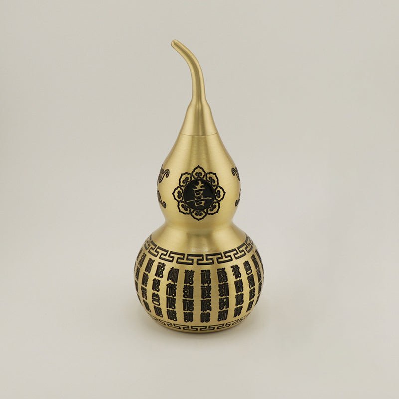 Detailed engraving of the Xi (喜) character for double happiness and joy on the Feng Shui gourd ornament.