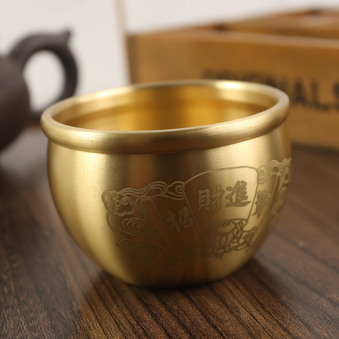 Feng Shui Brass Wealth Jar with coin, a "Hundred Fortunes" money pot for attracting abundance and good luck.